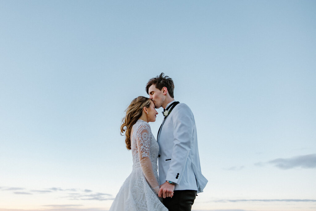 Couple kisses at Twickenham House and Hall wedding venue