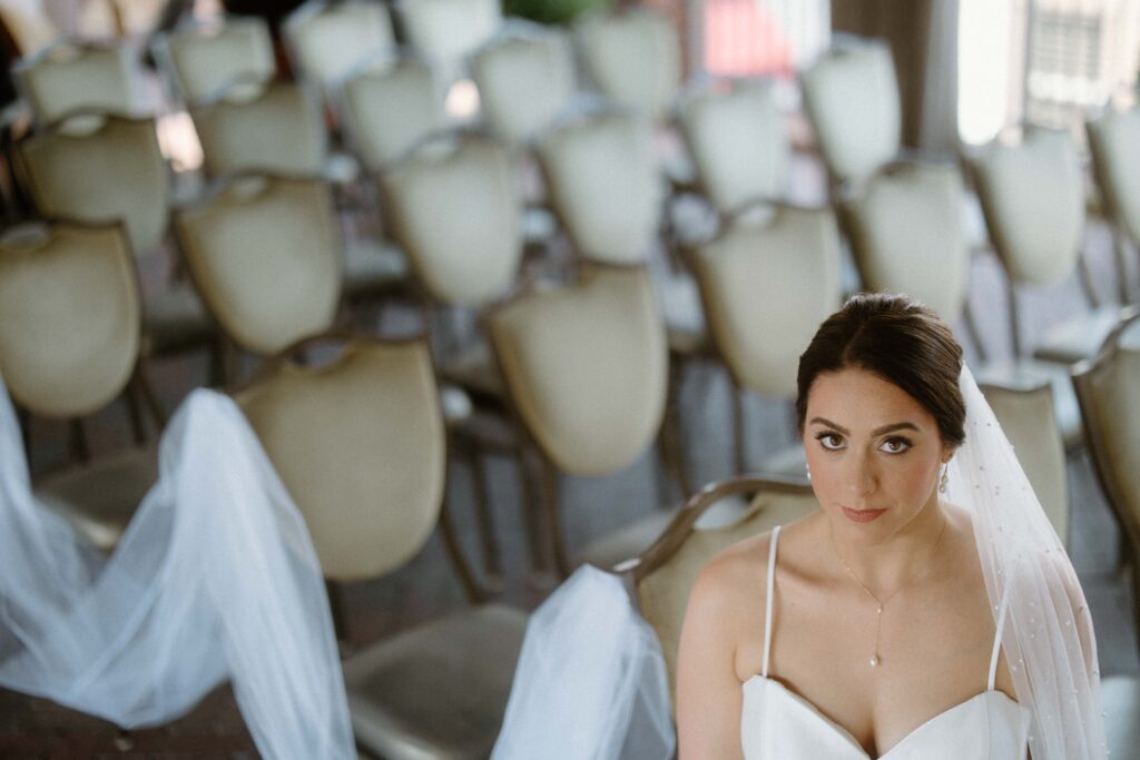 Couple embraces after their wedding at a grand piano at the Grand Bohemian Asheville
