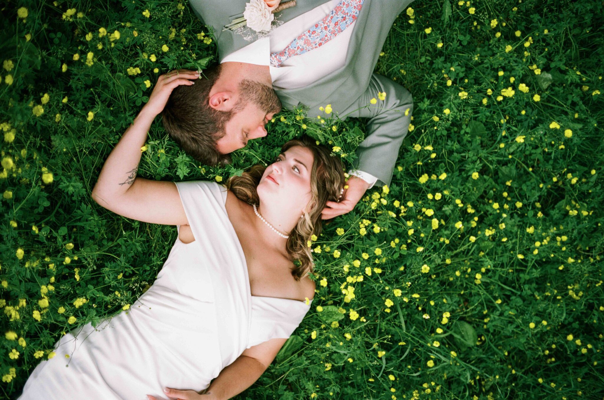 laying in flowers 35mm film photography of a wedding in asheville, nc
