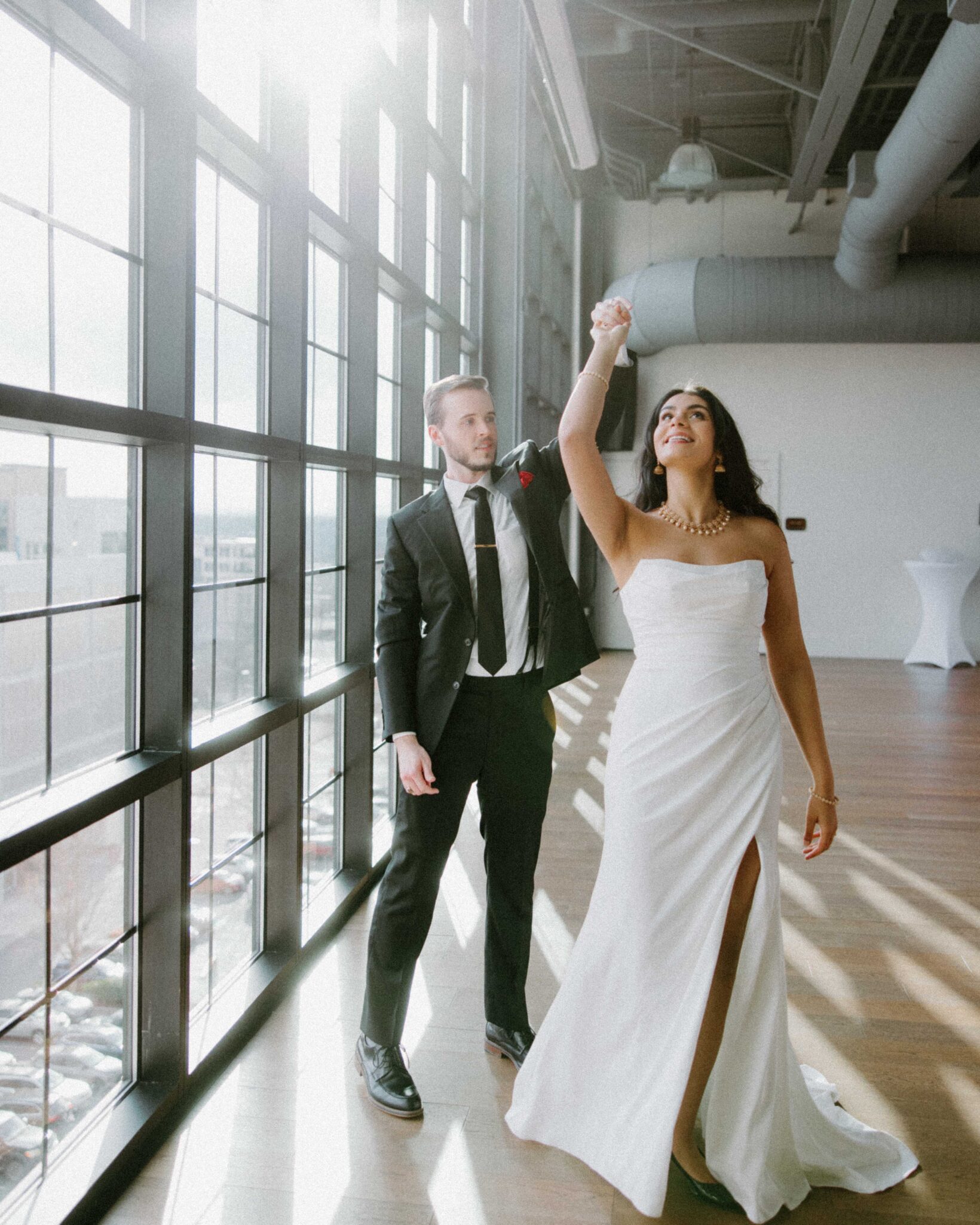 Bride and Groom in a bar in Asheville in Wedding Attire 