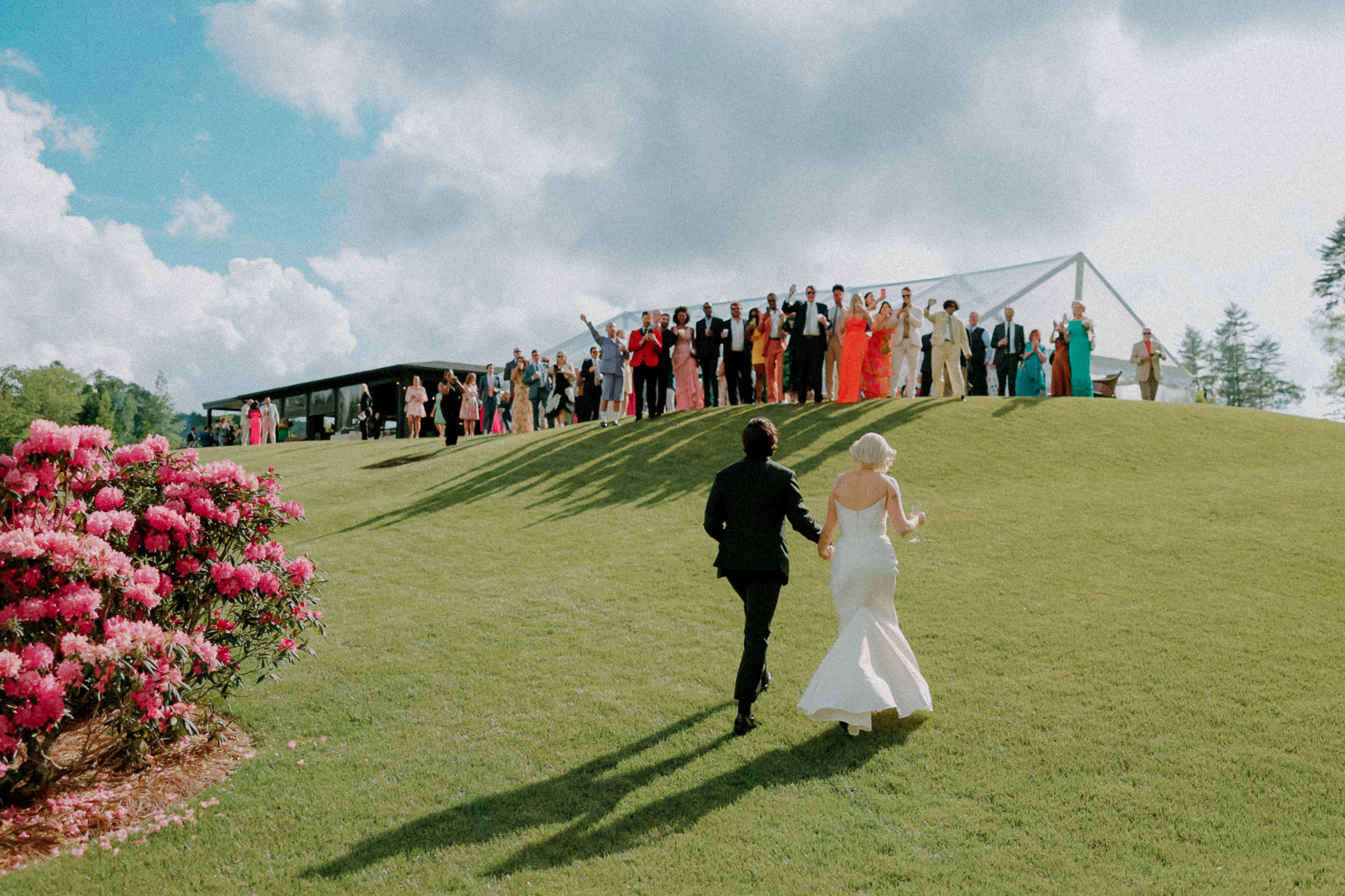 Bride and Groom walk up to greet their guests at High Hampton Resort, North Carolina