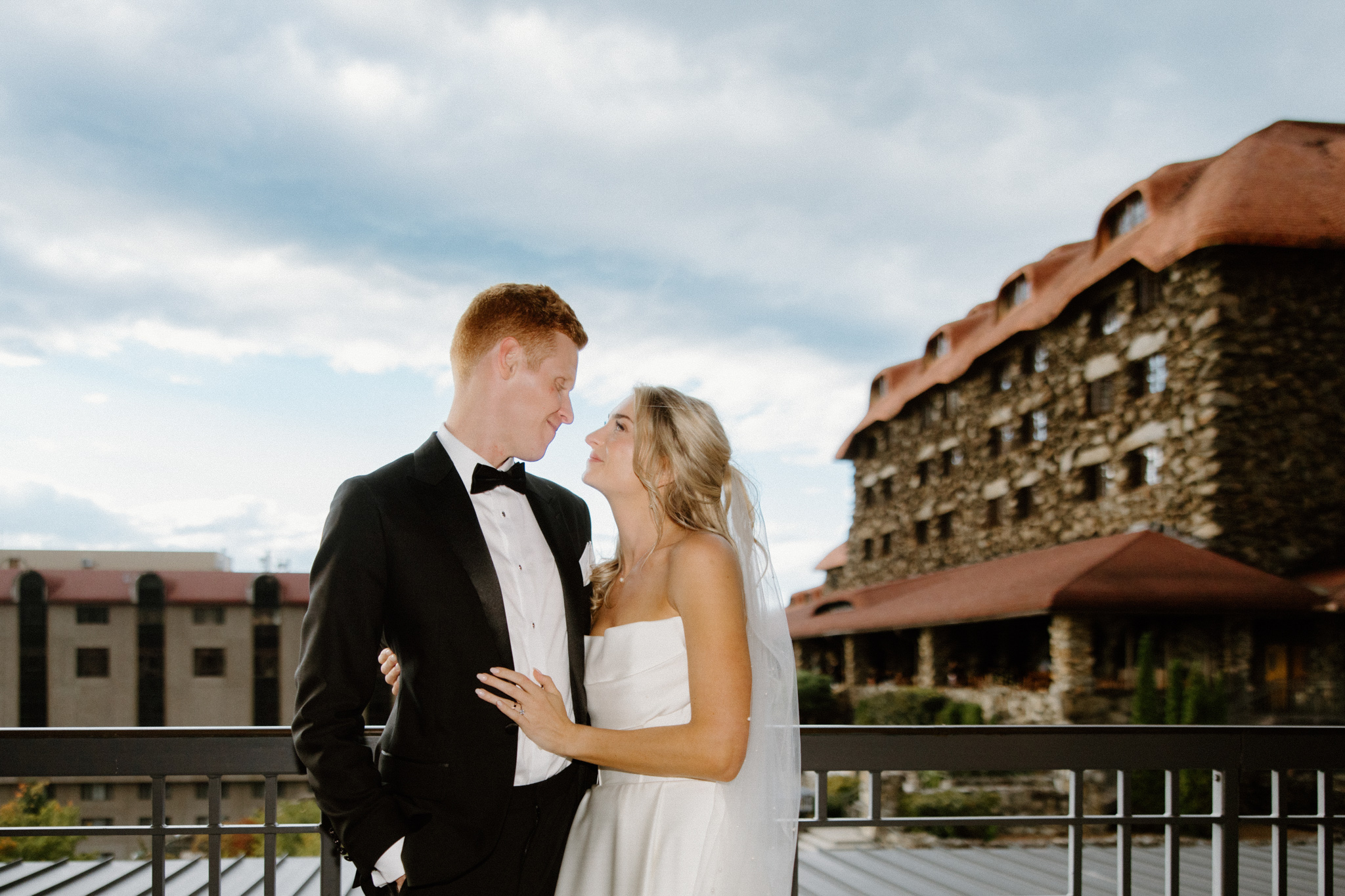Bride and Groom outside embracing in The Omni Grove Park Inn. 