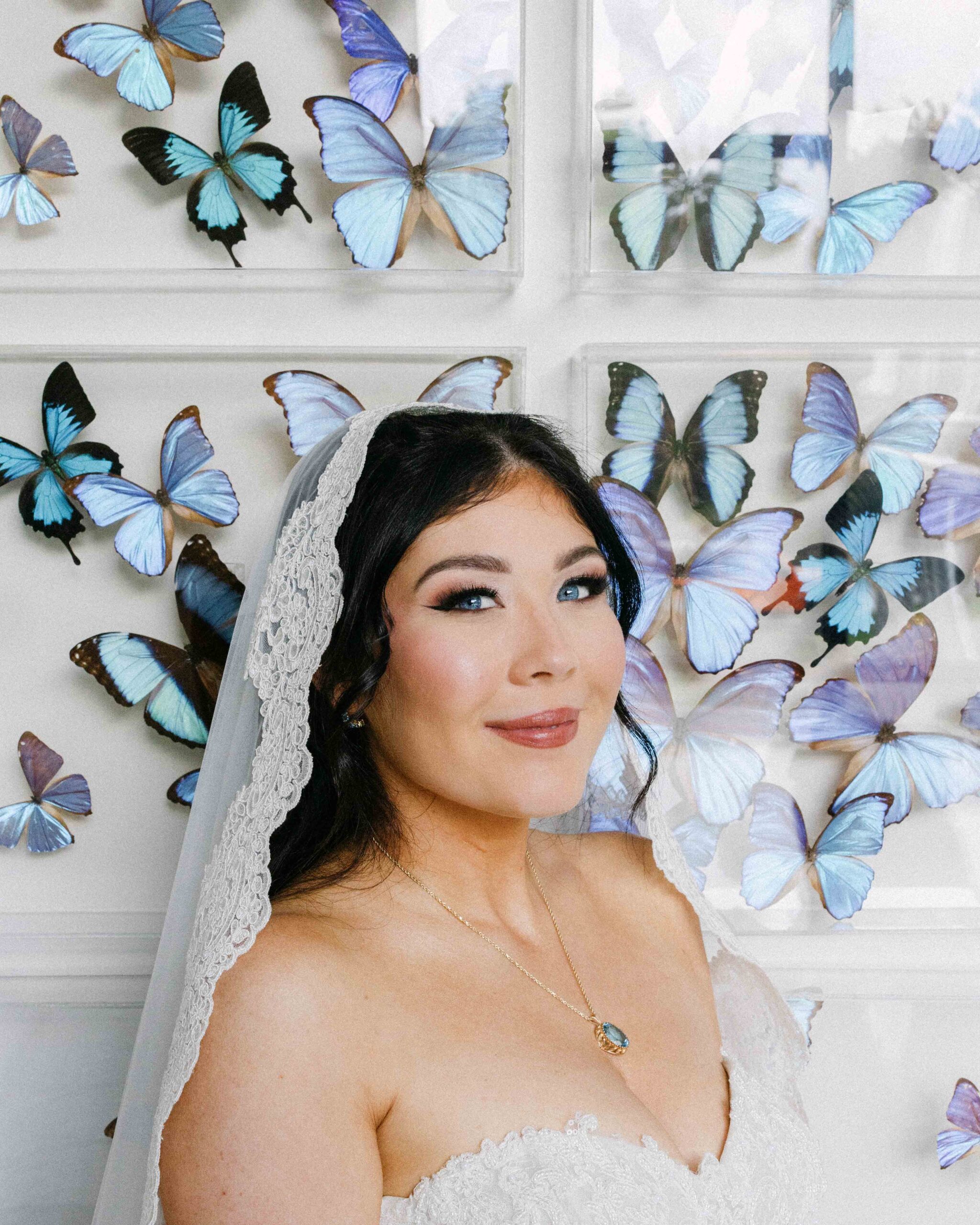 bride with butterflies at hawkesdene wedding venue