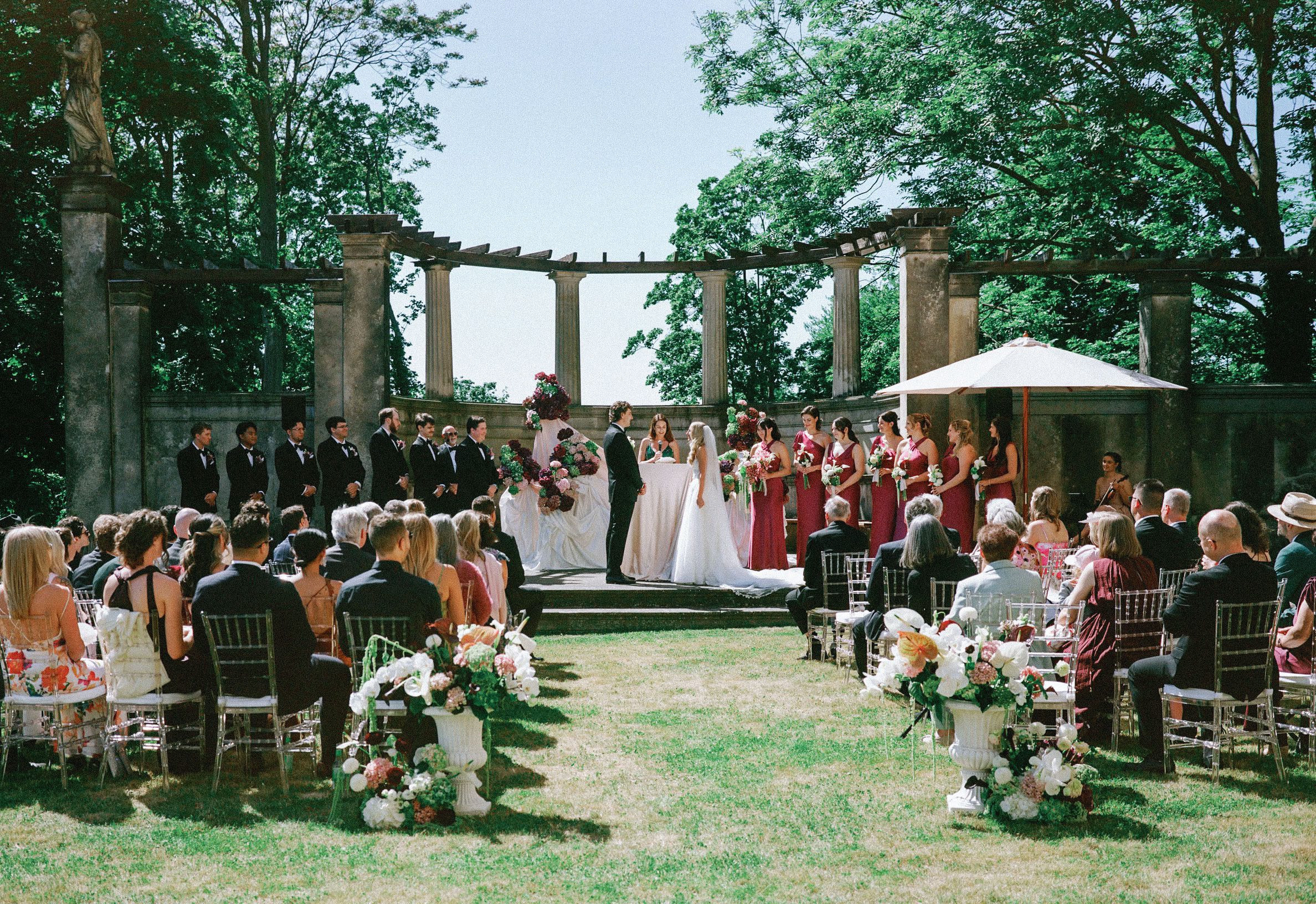Outdoor wedding ceremony in a garden courtyard, photographed on film