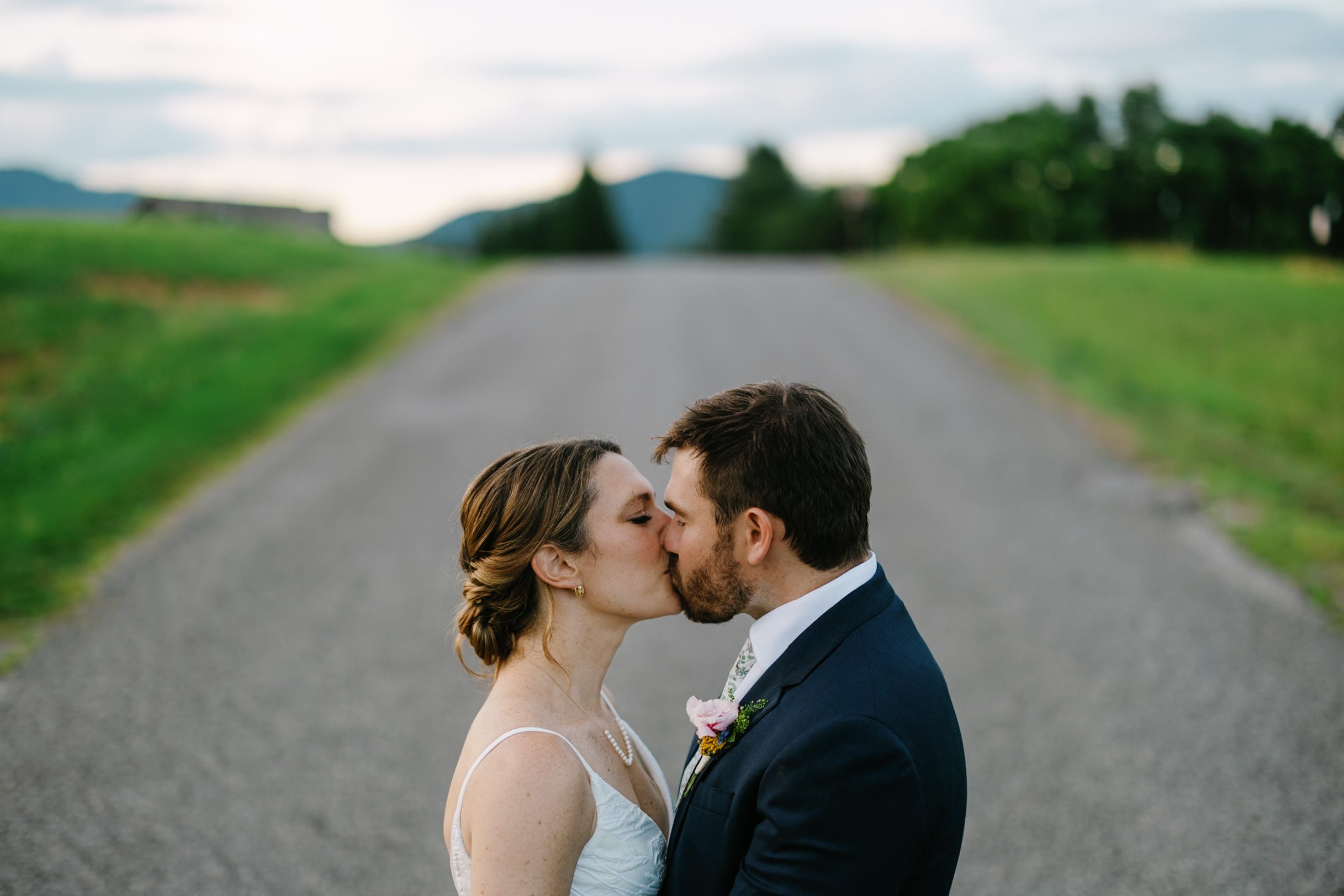 Couple kissing on the drive at The Farm