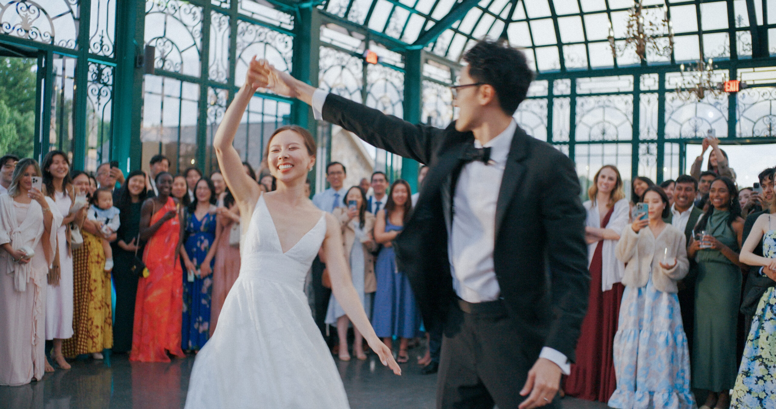Hao twirls Christie during their first dance inside the Solarium at Haven Ridge.