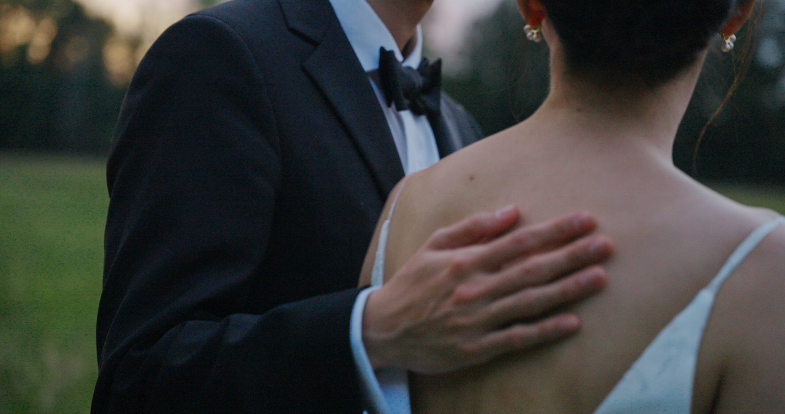Hao holds Christie close during an intimate portrait in the meadow.