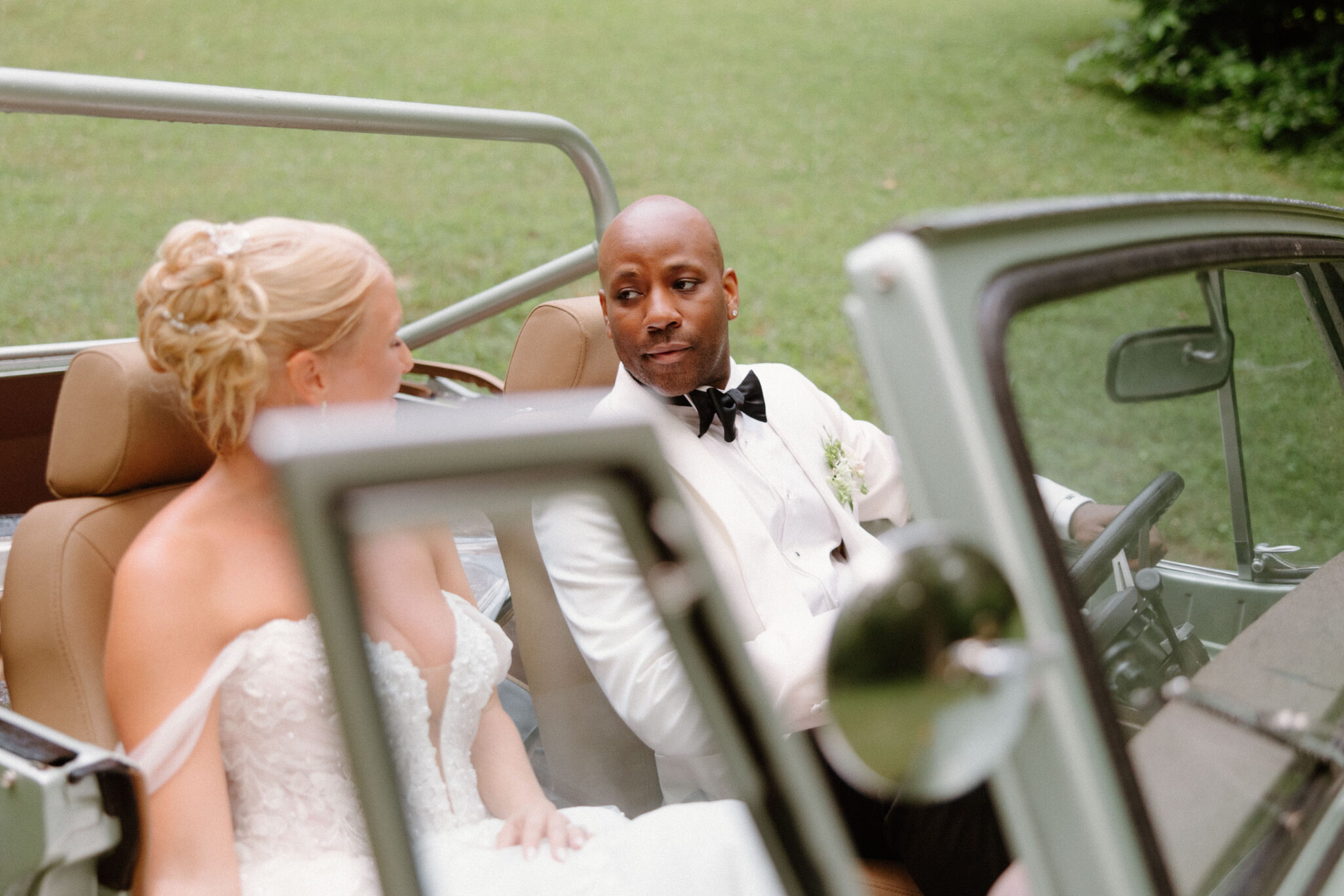 bride and groom in a classic car at Douglas Ellington House