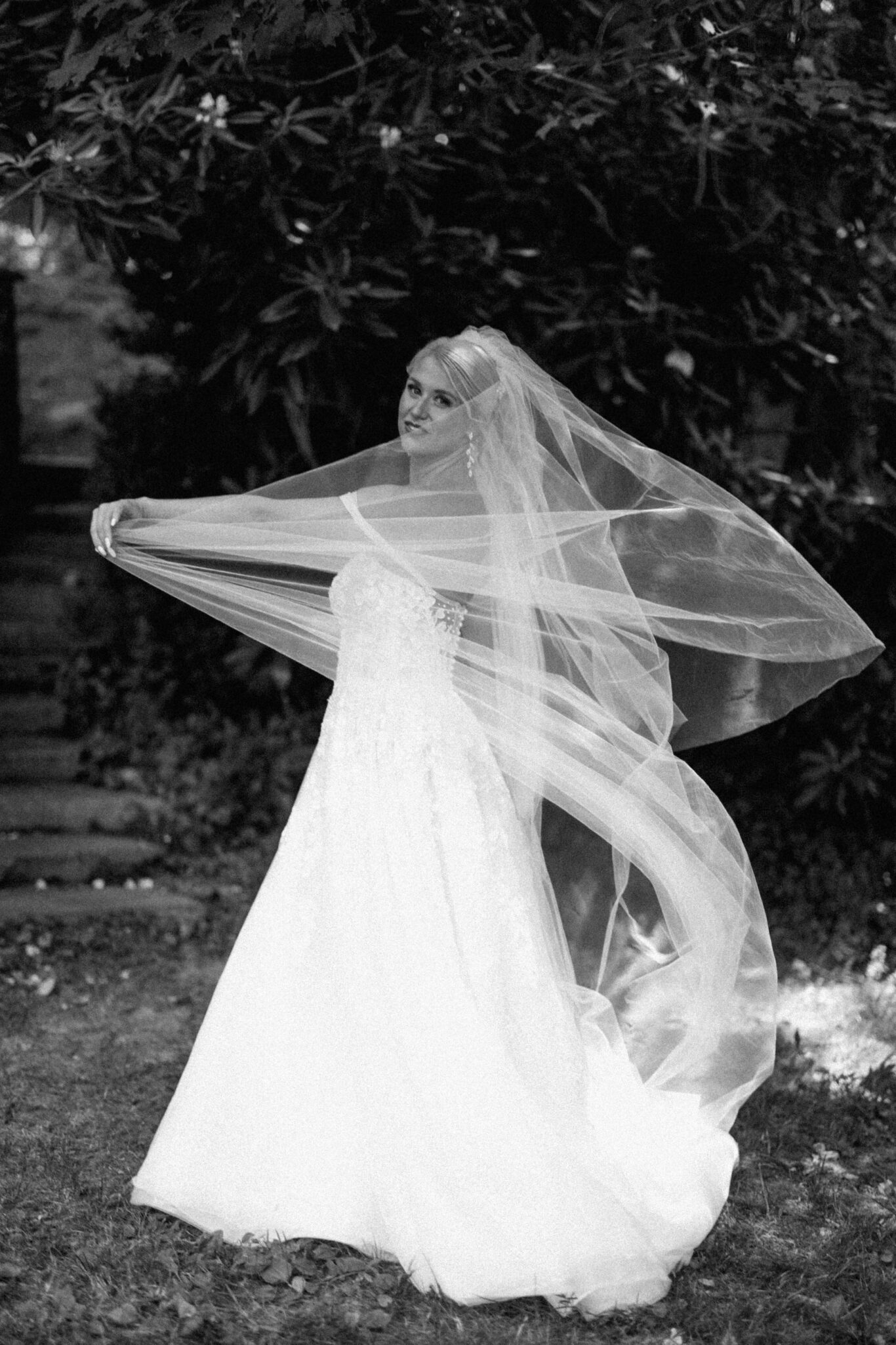 Bridal portraits outside in the greenery black and white