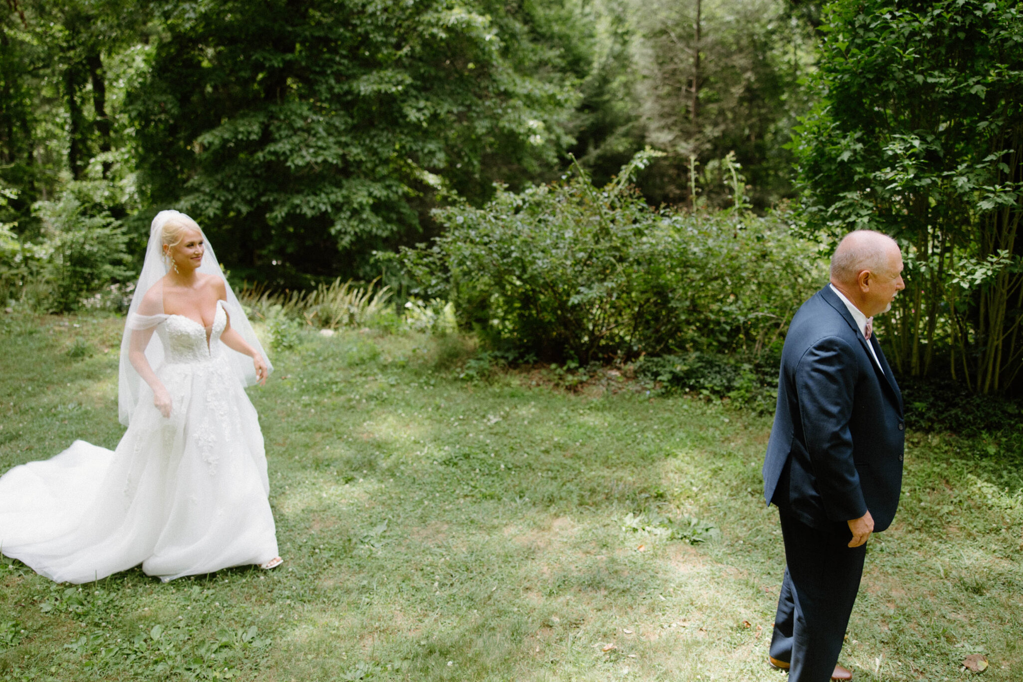 Bride first look with dad on wedding day at Douglas Ellington House Asheville