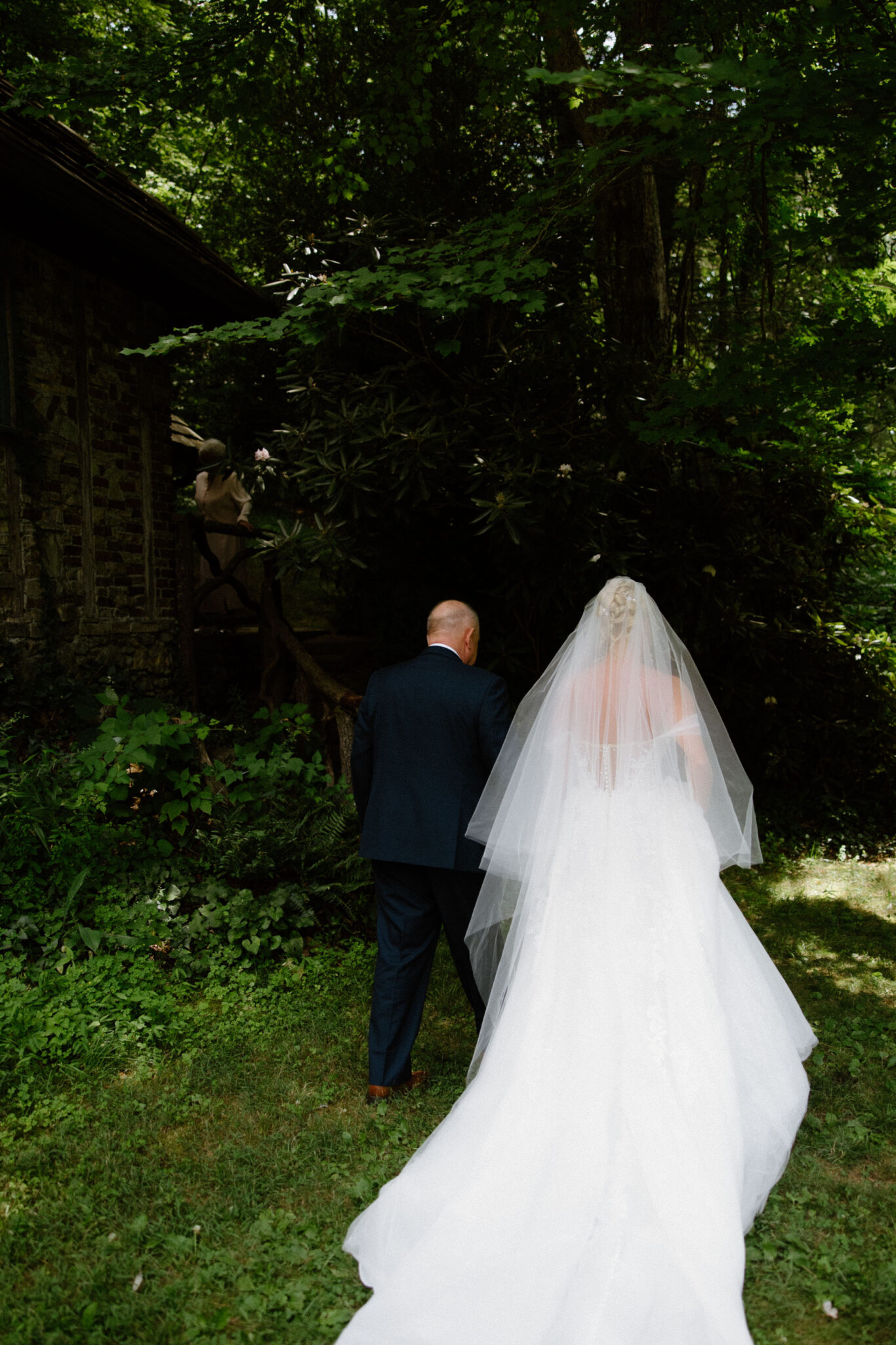 Bride first look with dad on wedding day at Douglas Ellington House Asheville