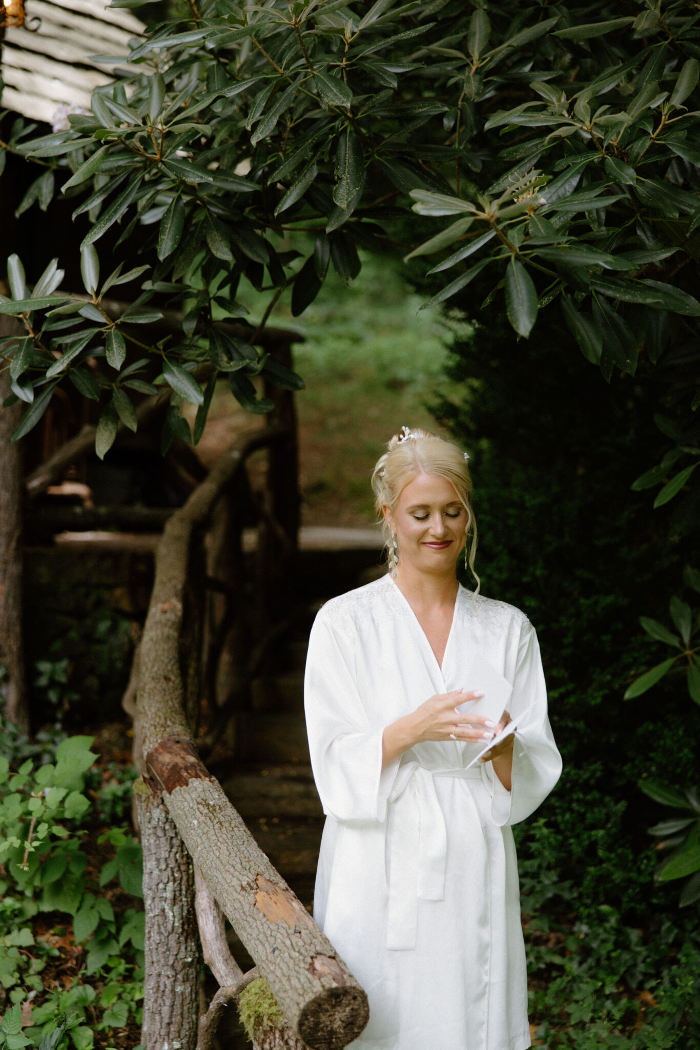 Bride reading a letter on her wedding morning