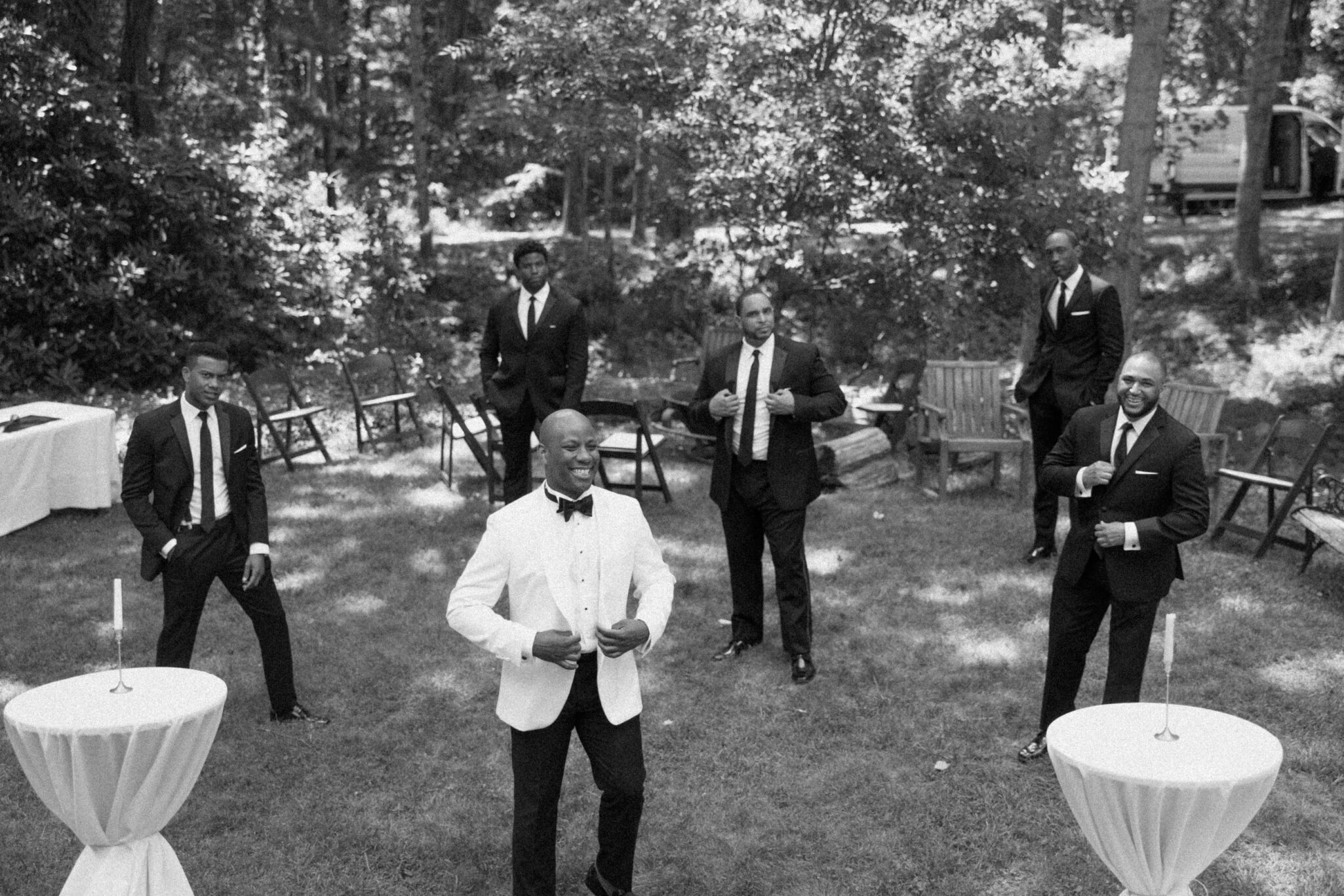 Groom and Groomsmen hanging out before wedding ceremony black and white