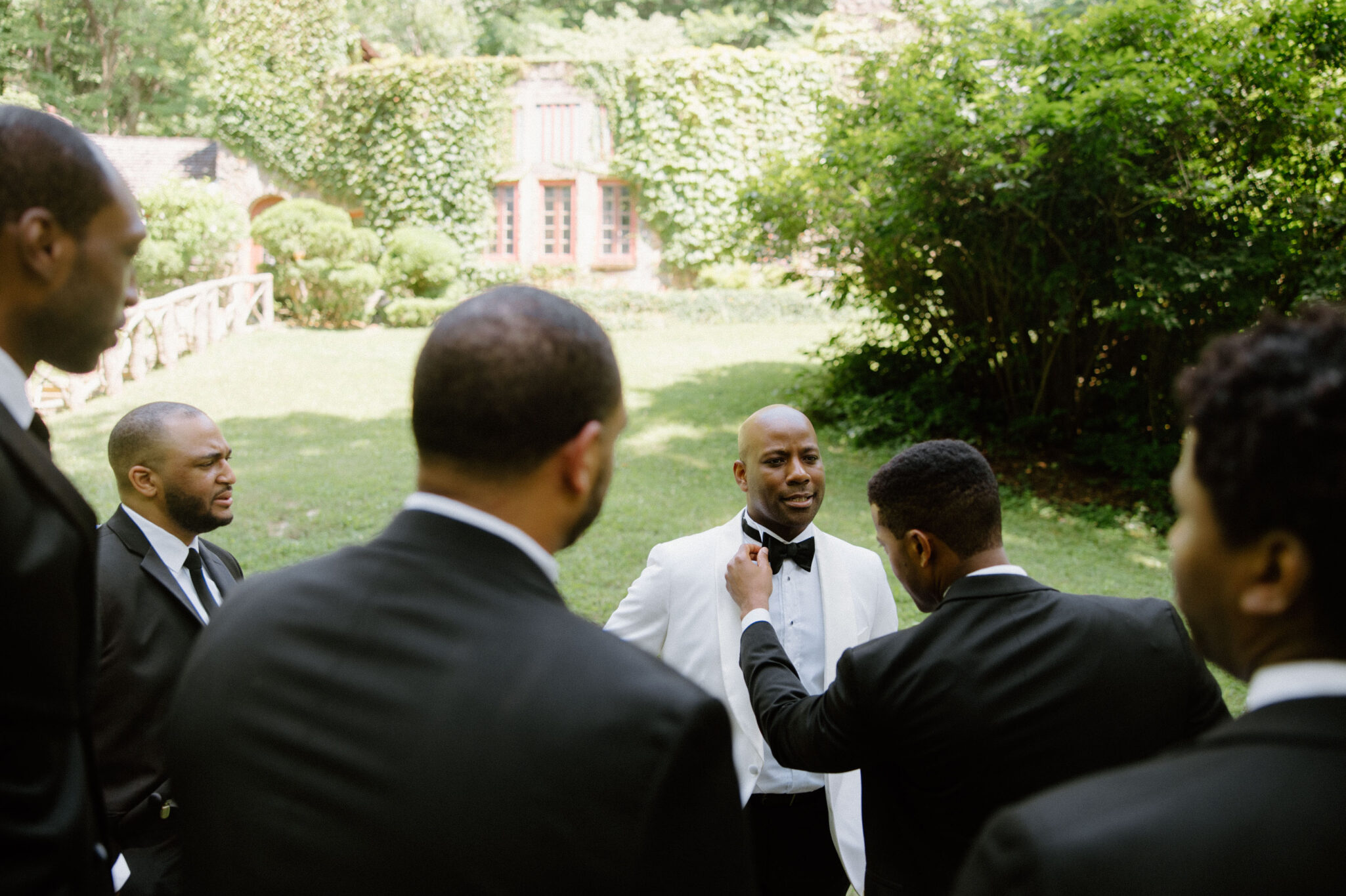 Groom and Groomsmen hanging out before wedding ceremony