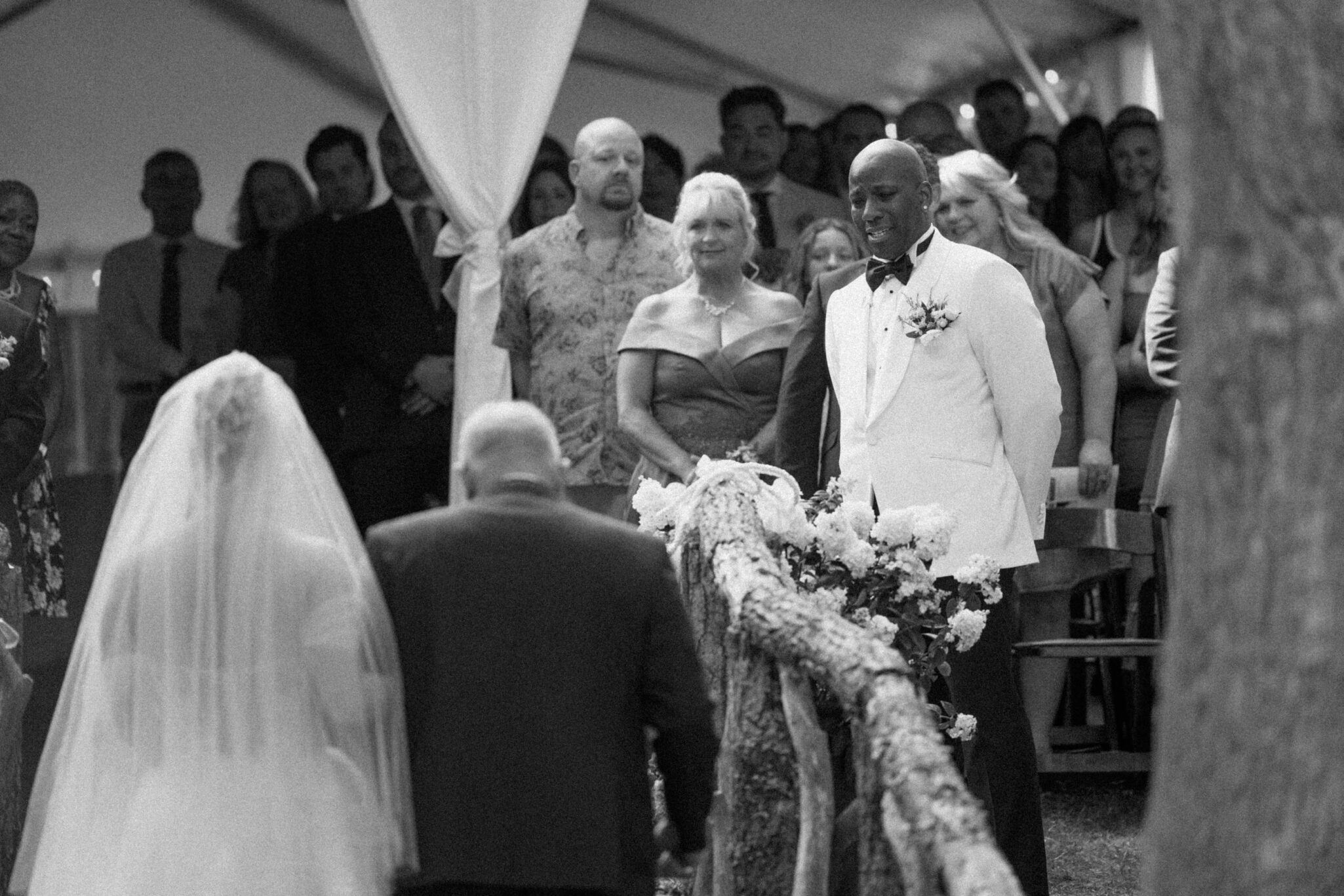 Grooms reaction to Bride walking down the isle with father at Douglas Ellington House