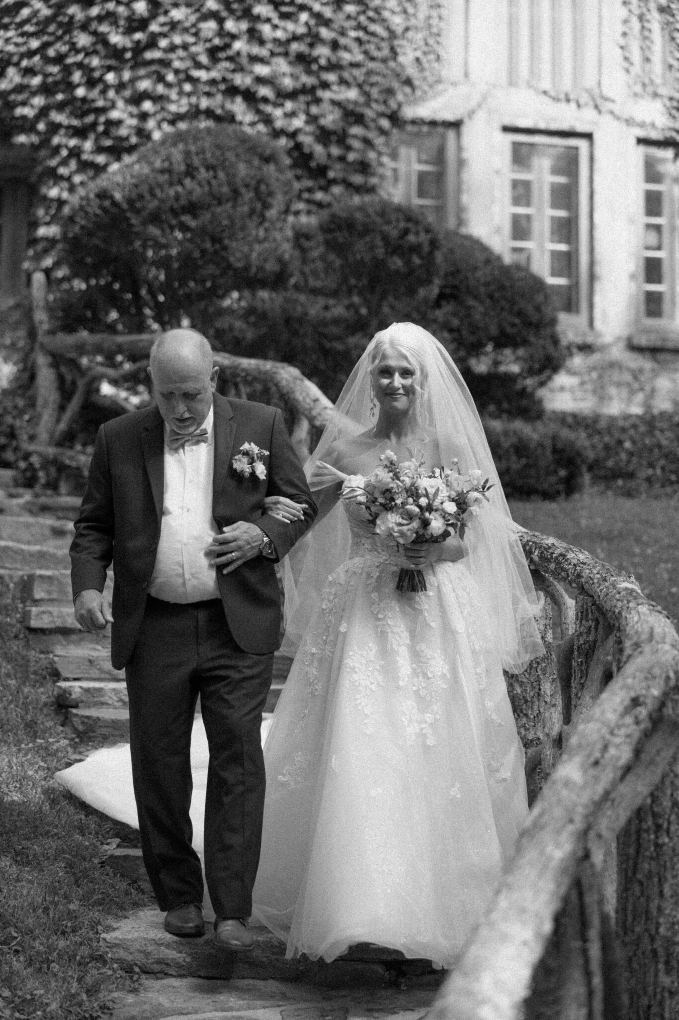 Bride walking down the isle with father at Douglas Ellington House