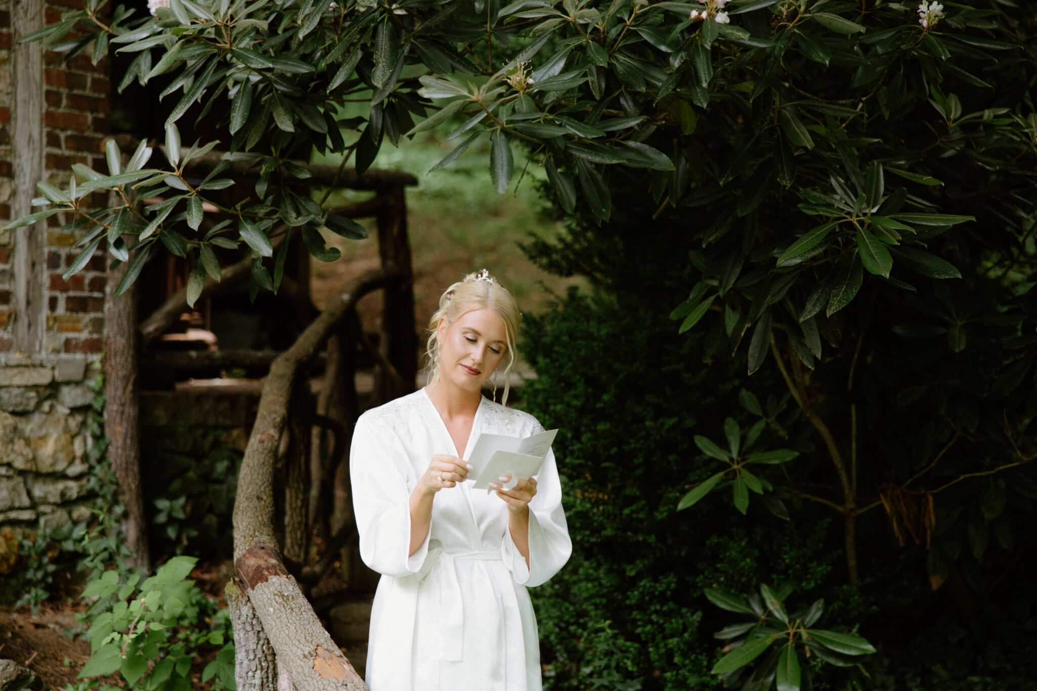 Bride reading a letter on her wedding morning