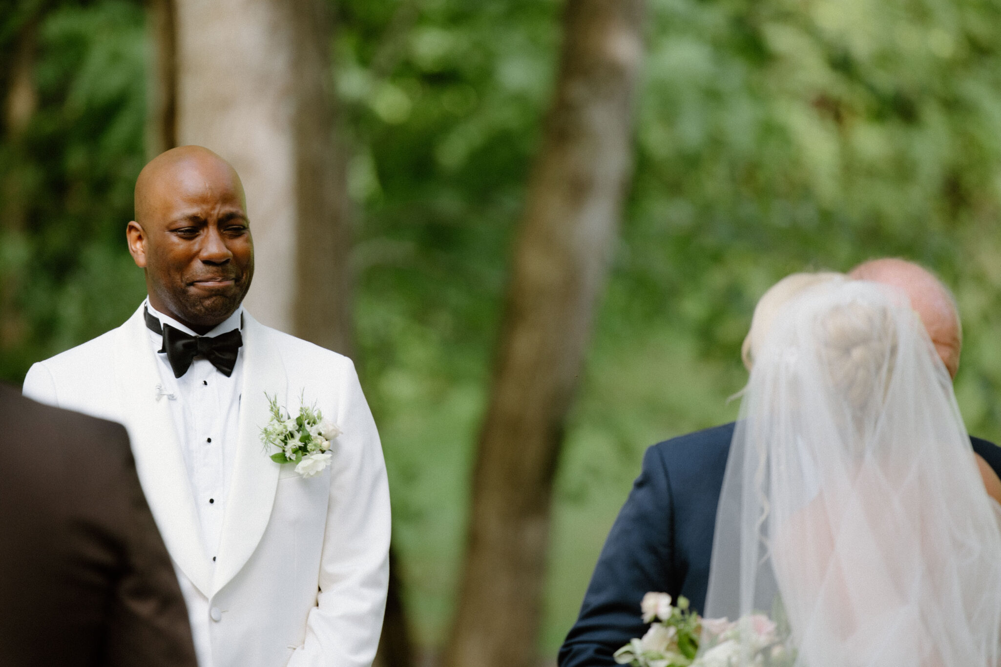 groom reaction to Bride walking down the isle with father at Douglas Ellington House