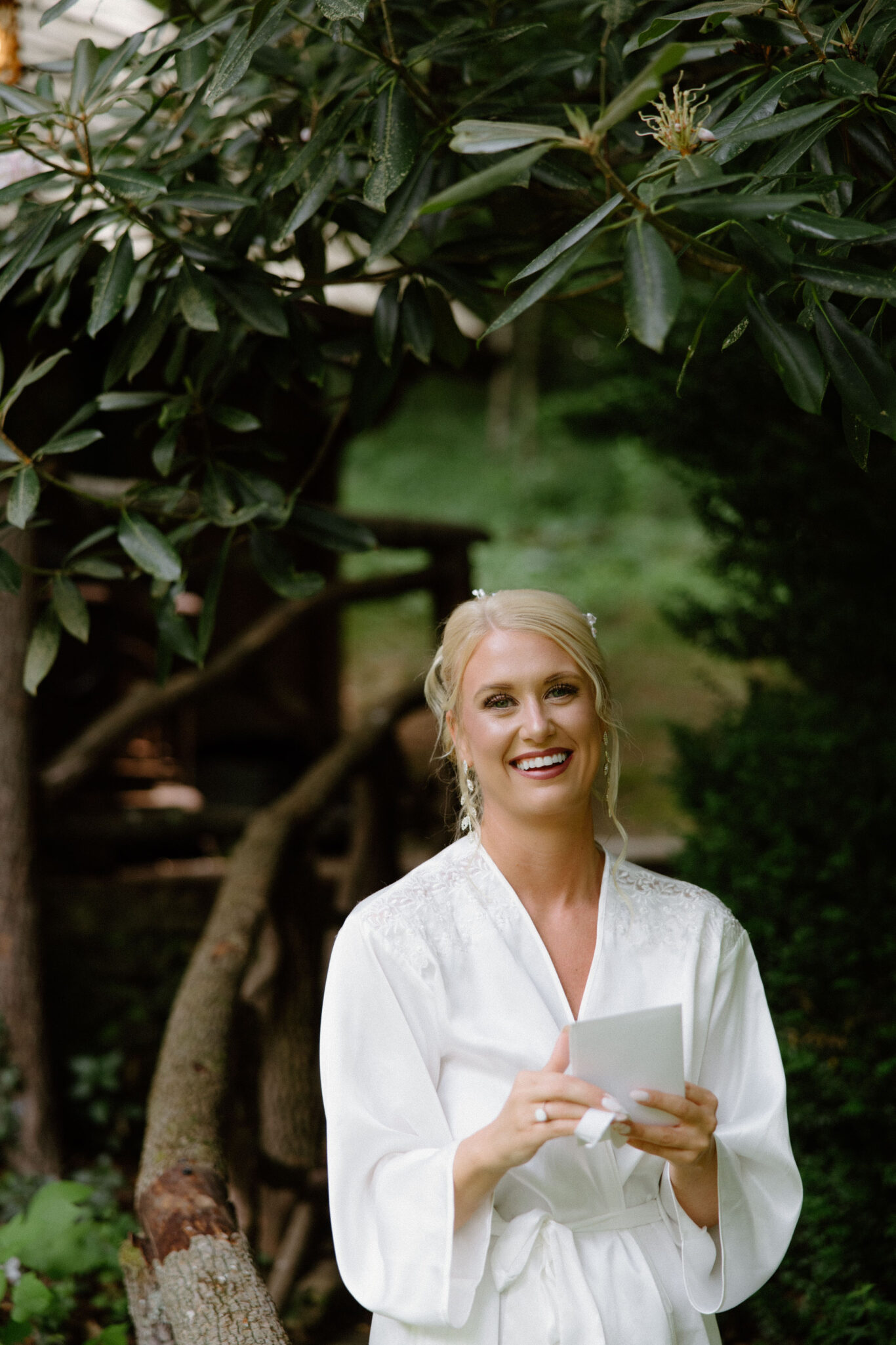 Bride reading a letter on her wedding morning