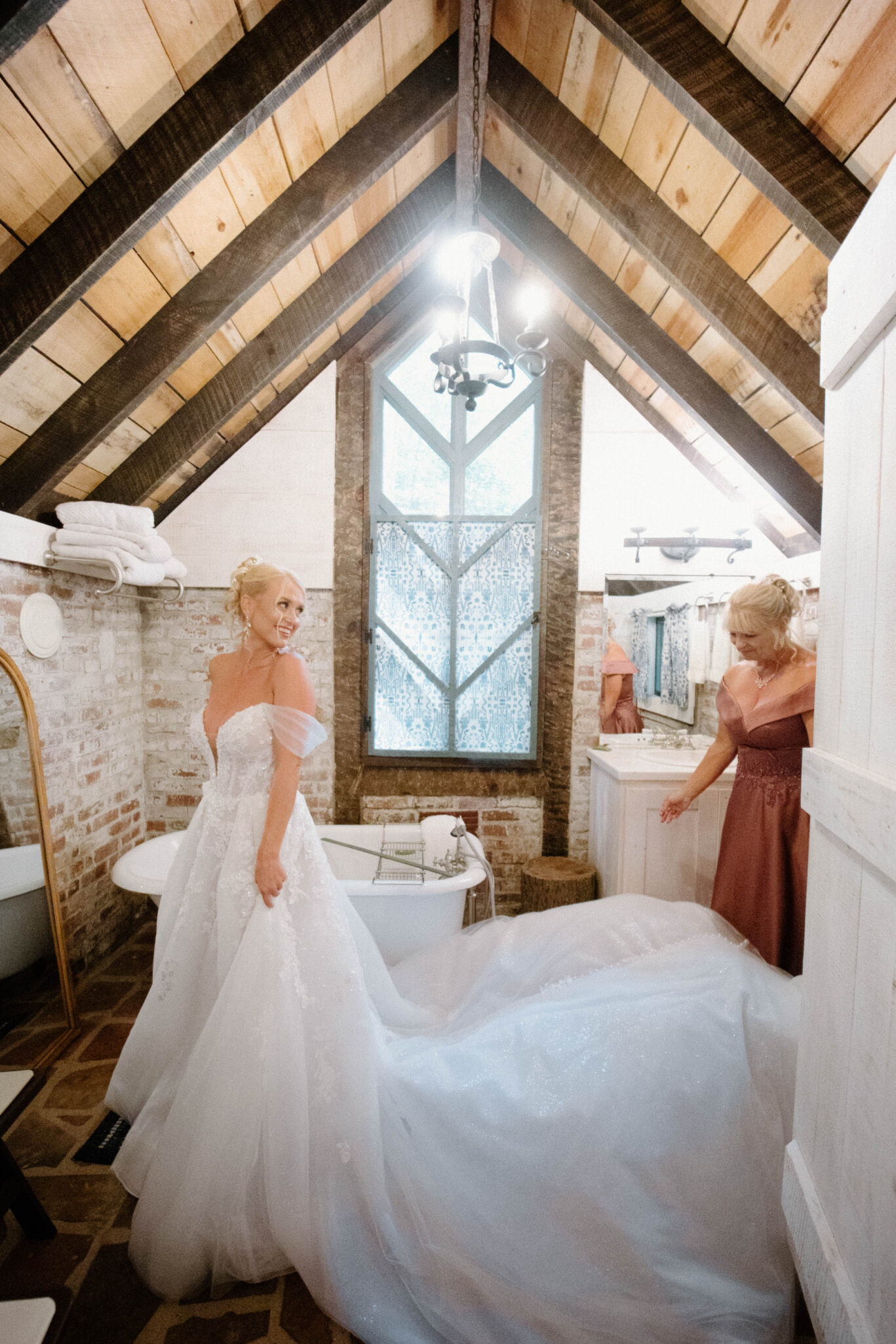 Bride getting ready into her wedding dress