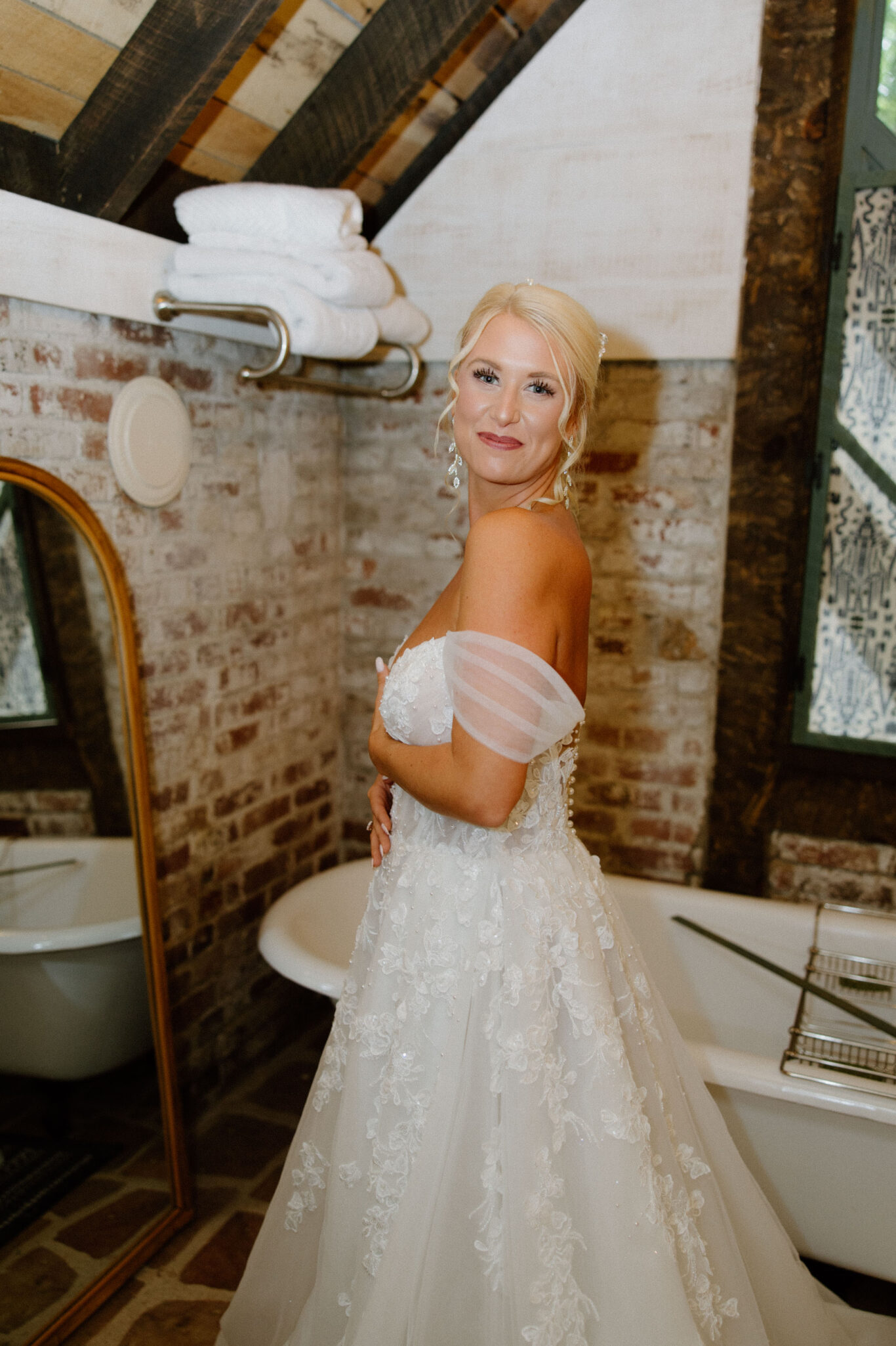 Bride getting ready into her wedding dress