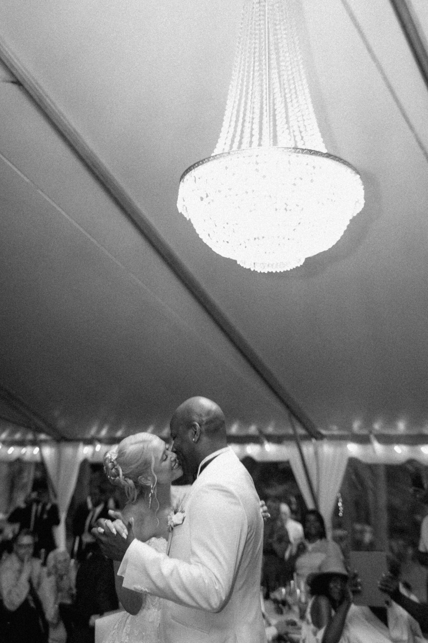 Bride and Groom around family at wedding Reception outside at Douglas Ellington House