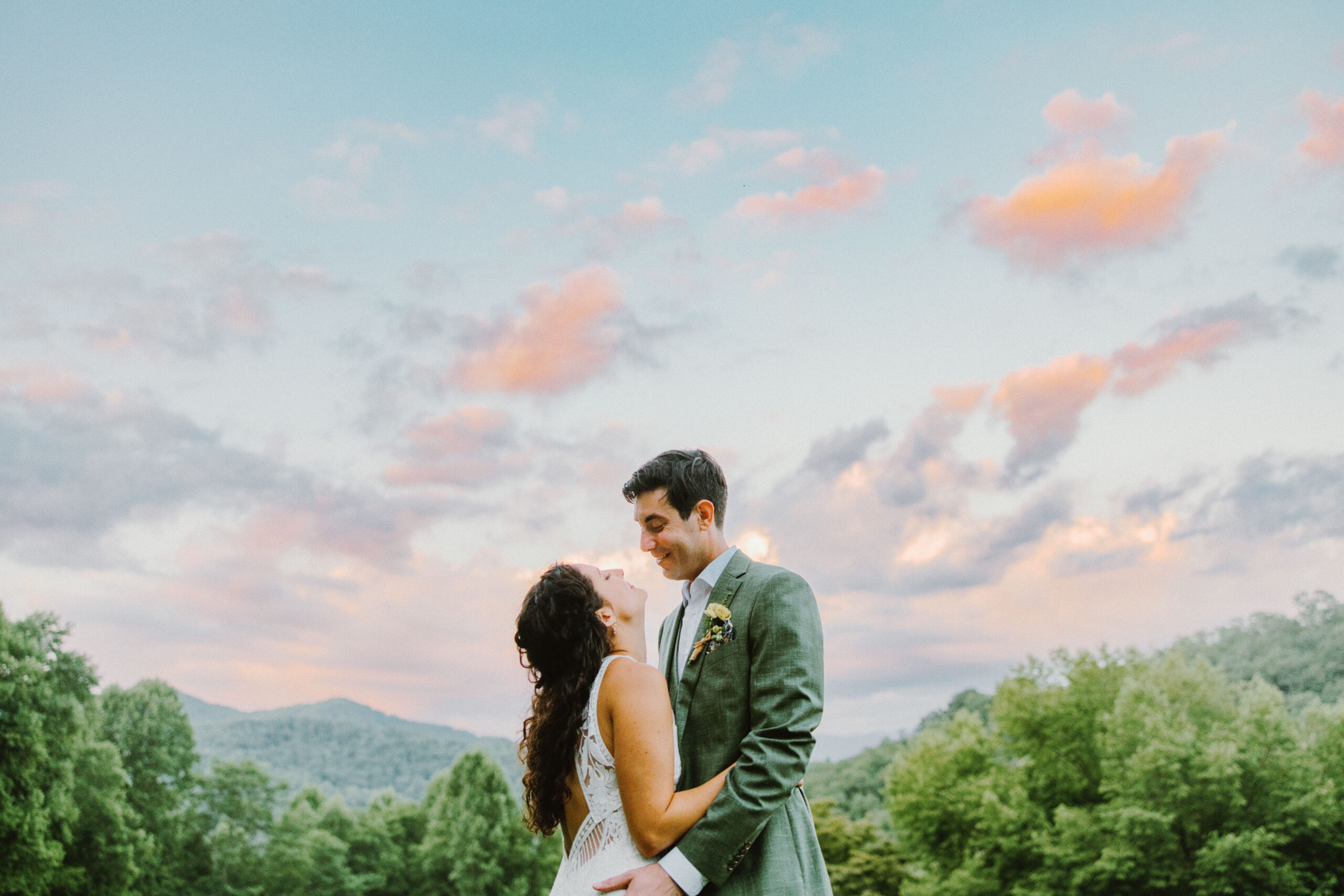 bride and groom sunset sky and colorful clouds