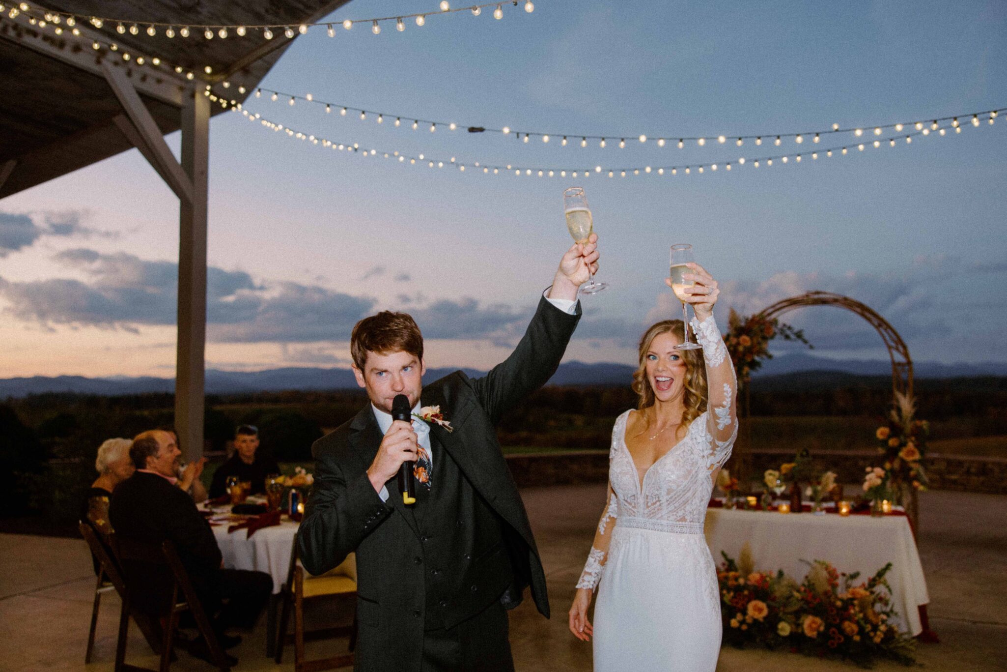 bride and groom toast with Champaign at wedding reception at Chattooga Belle Farm.