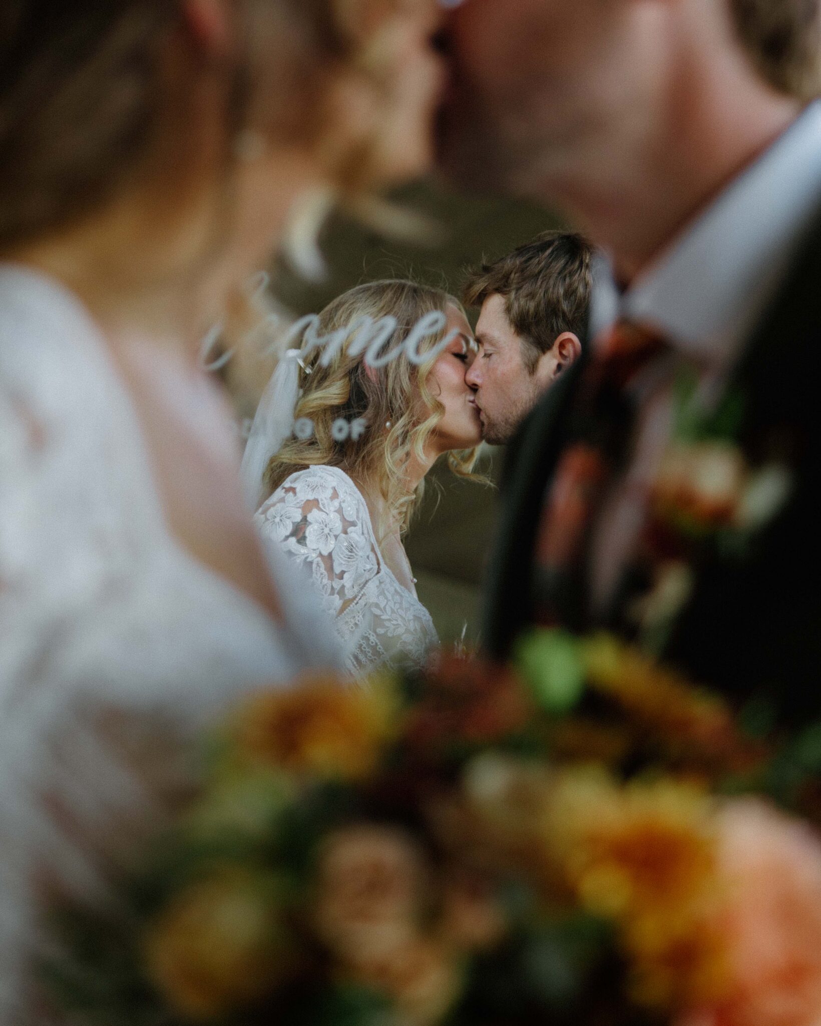 Couple kisses in front of a mirror at Chattooga Belle Farm.