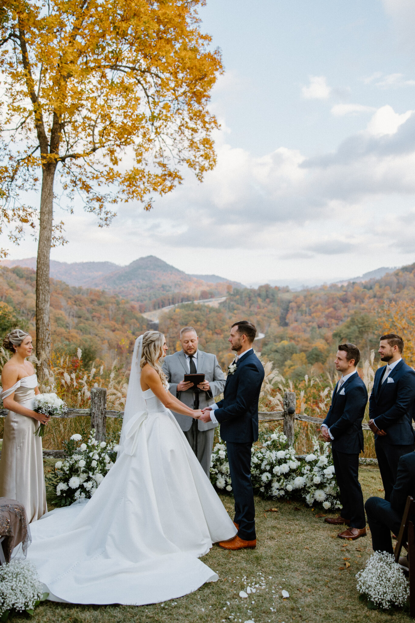 Fall Mountaintop mansion Wedding Ceremony at Castle Ladyhawke  couple holding hands
