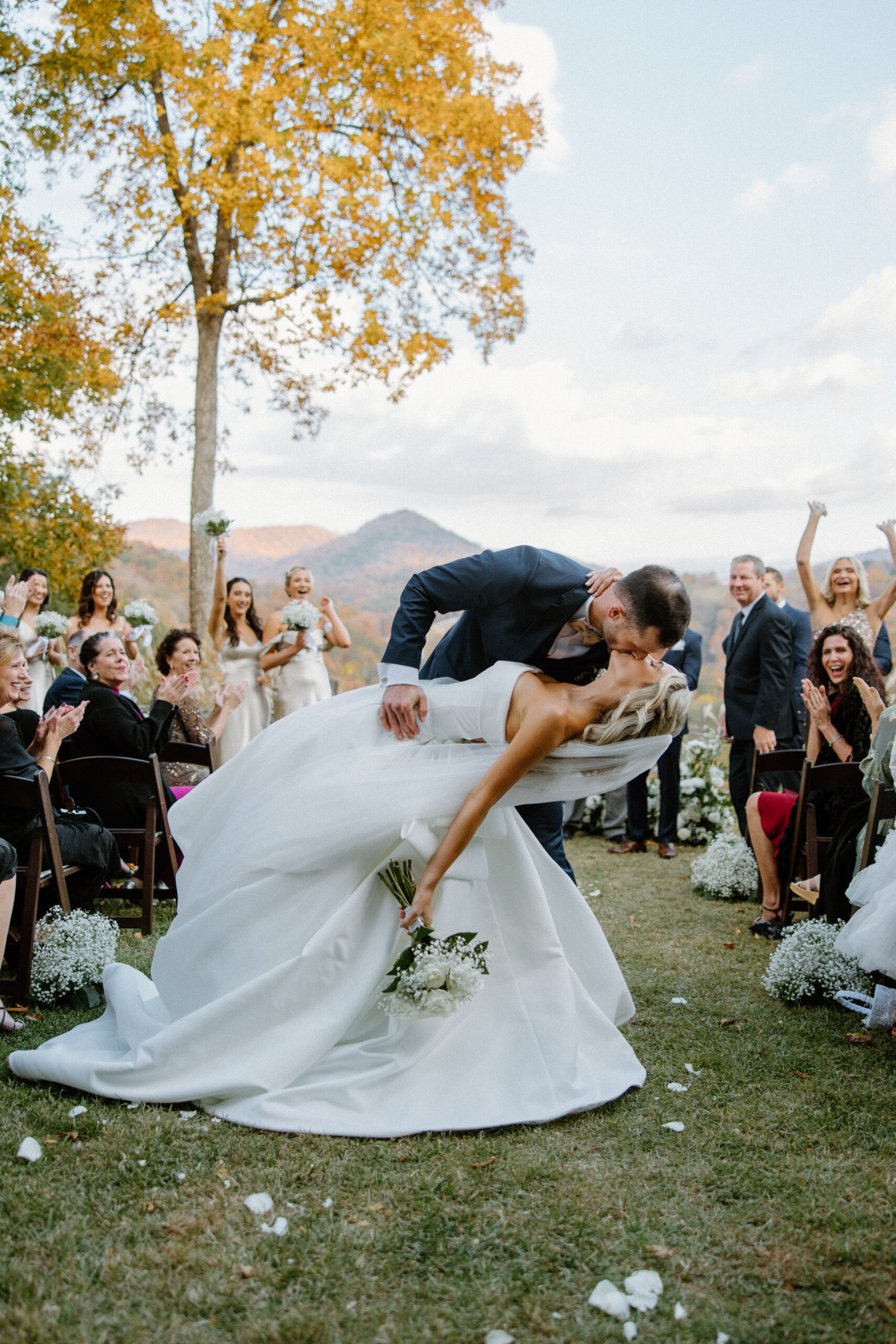 Bride and Groom dip and kiss after their wedding ceremony at Castle Ladyhawke.