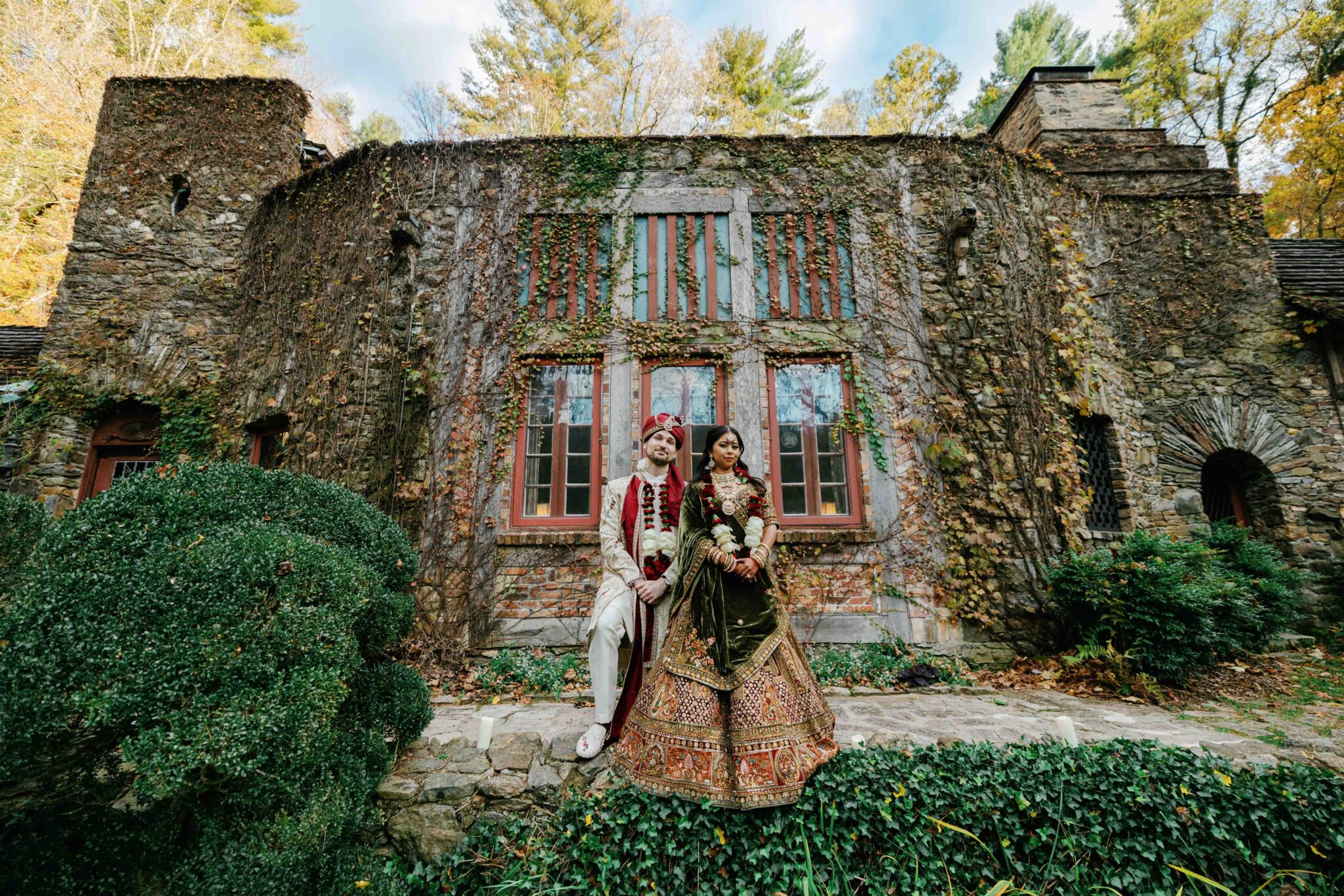 Cinematic couple’s portrait surrounded by spring color at an Asheville Indian wedding.